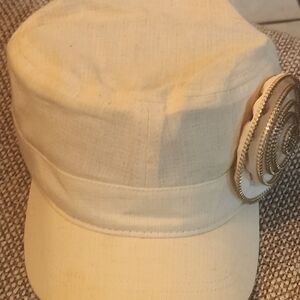 Women's Cream Hat with a Gold trim Rose on the front left side of hat